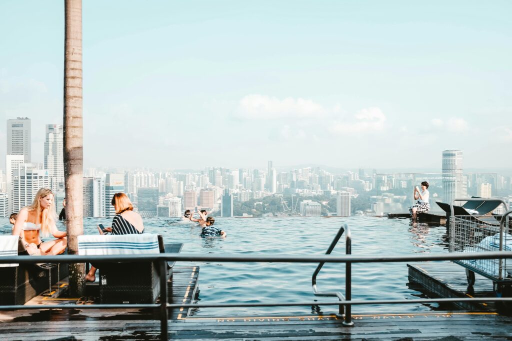Infinity pool overlooking city skyline.