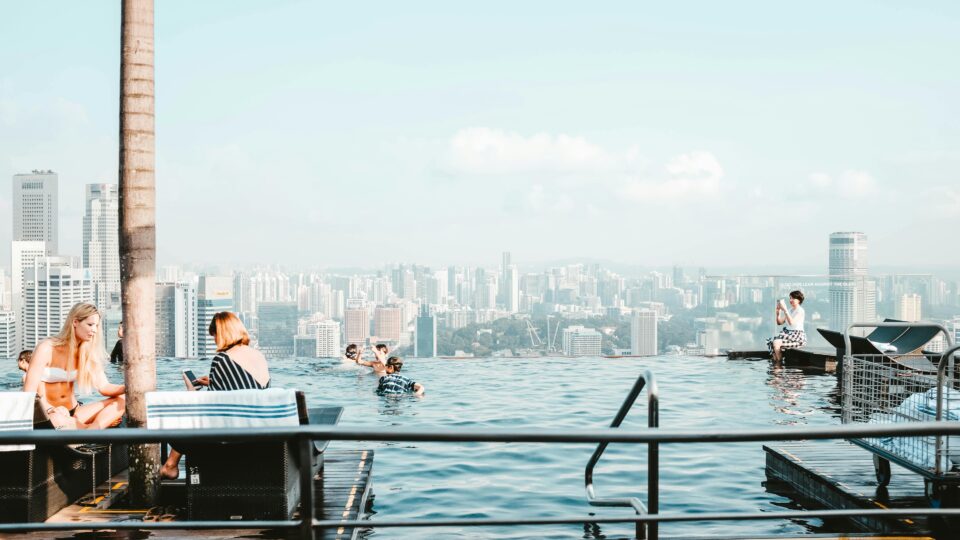 Infinity pool overlooking city skyline.