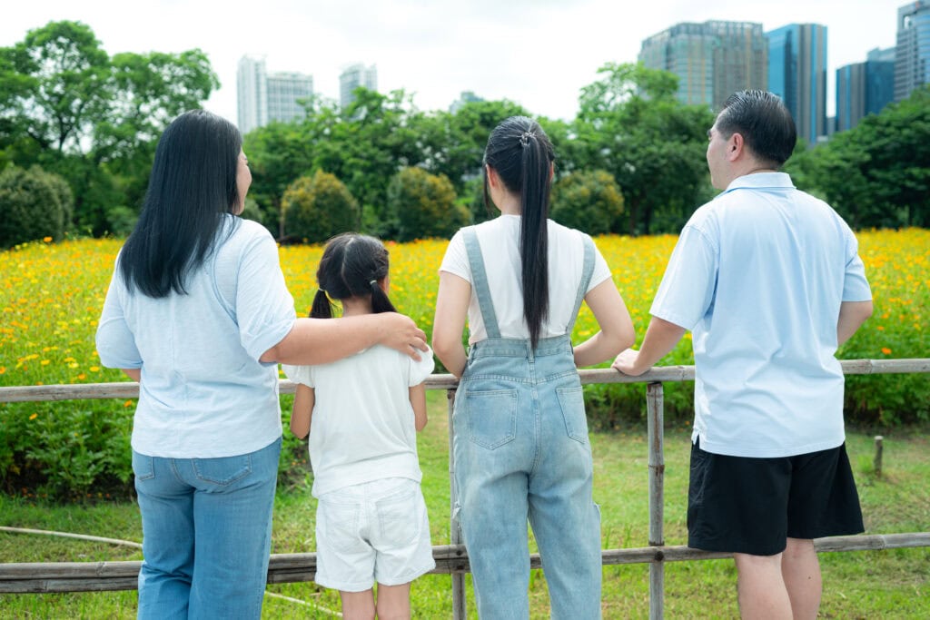 Family enjoying a scenic outdoor view.
