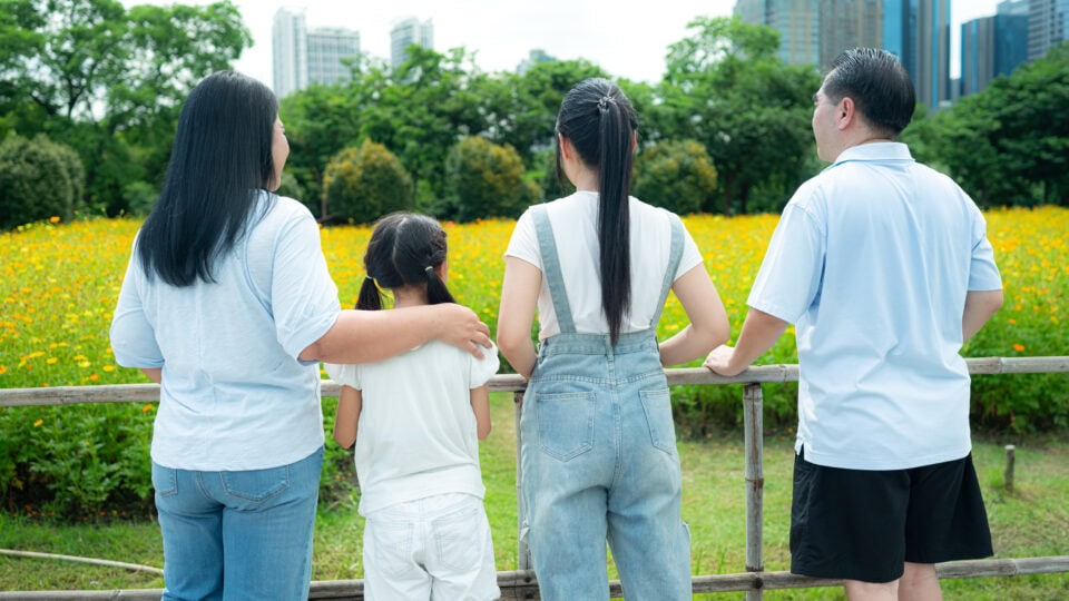 Family enjoying a scenic outdoor view.
