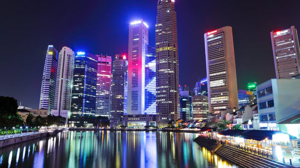 Vibrant skyline reflecting on water.