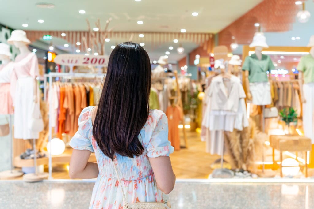 Woman shopping in a clothing store.