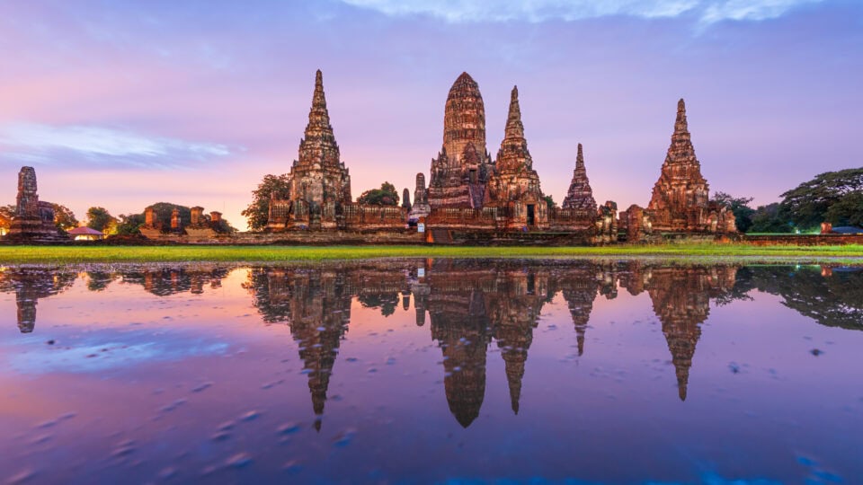 Historic temple reflecting in water.