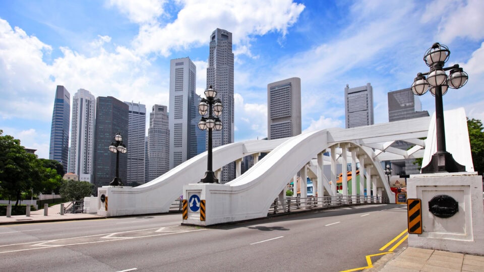 Modern bridge with city skyline backdrop