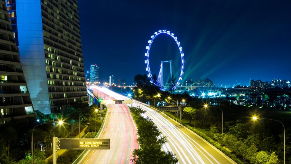 Night view of Singapore skyline and highway