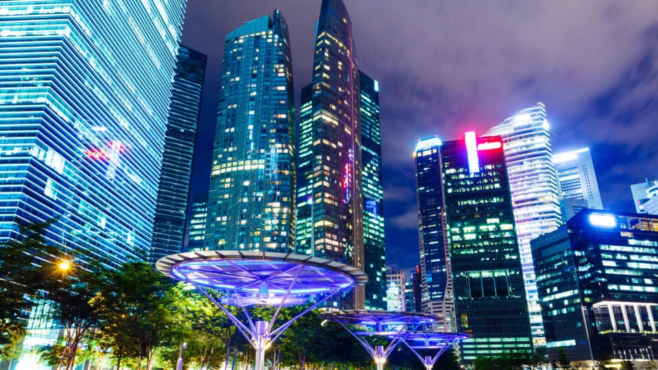 Illuminated skyscrapers at night.