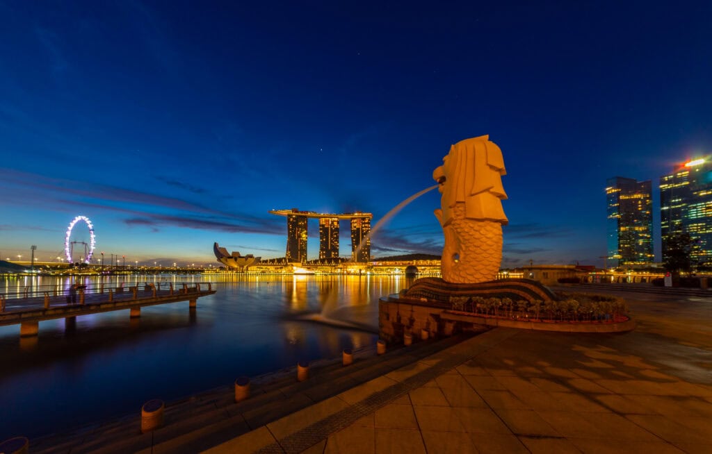 Merlion statue with city skyline backdrop