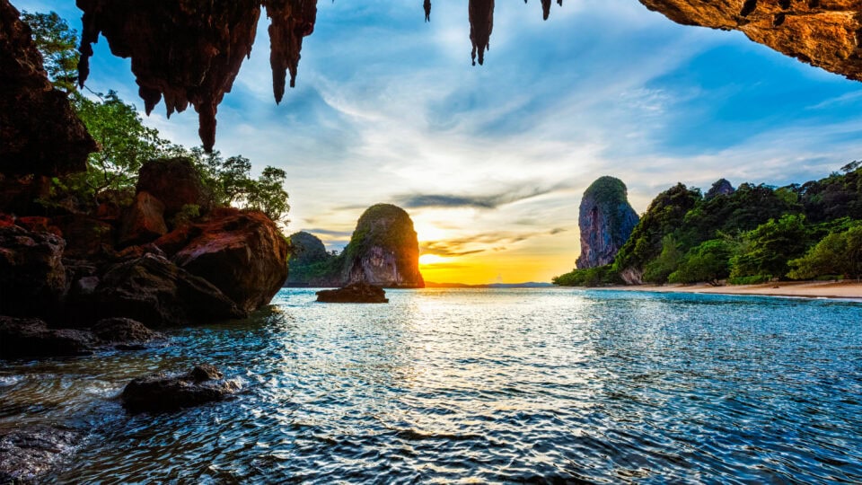 Scenic sunset over tranquil beach.