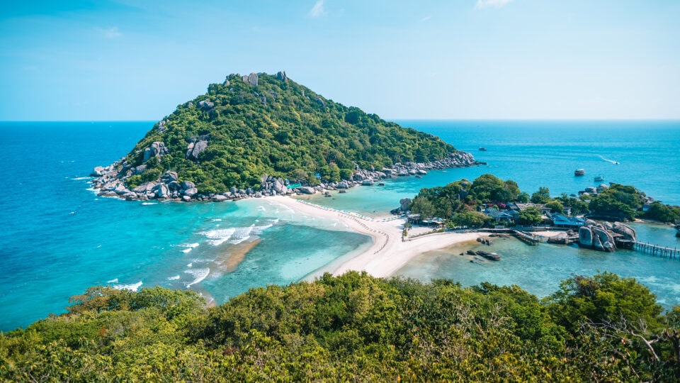Scenic tropical island with clear waters.