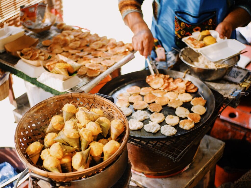 Street vendor making coconut pancakes