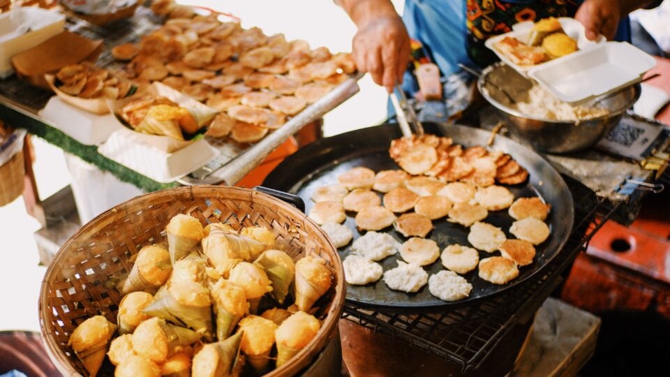 Street vendor making coconut pancakes