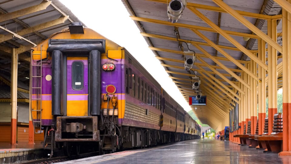 Colorful train at a quiet station.