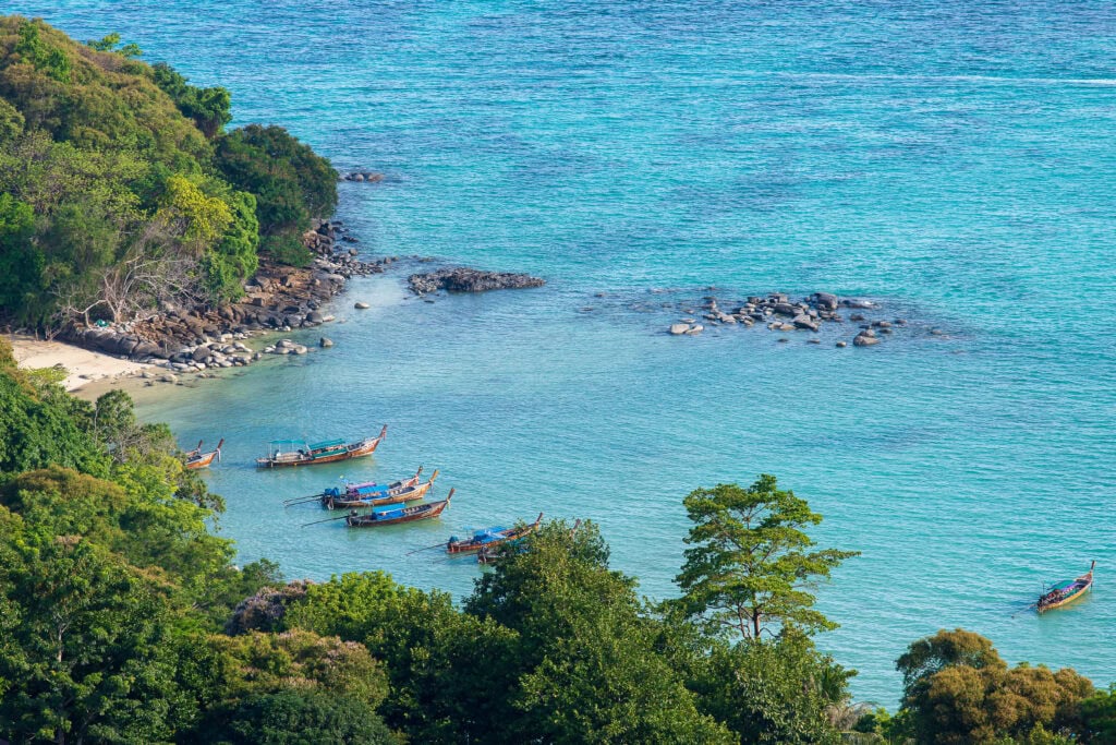 Boats anchored in a serene bay.