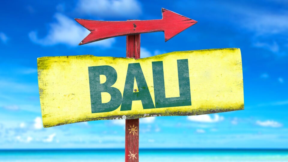 Signpost pointing to Bali beach