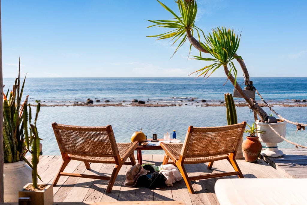 Two chairs by serene ocean view