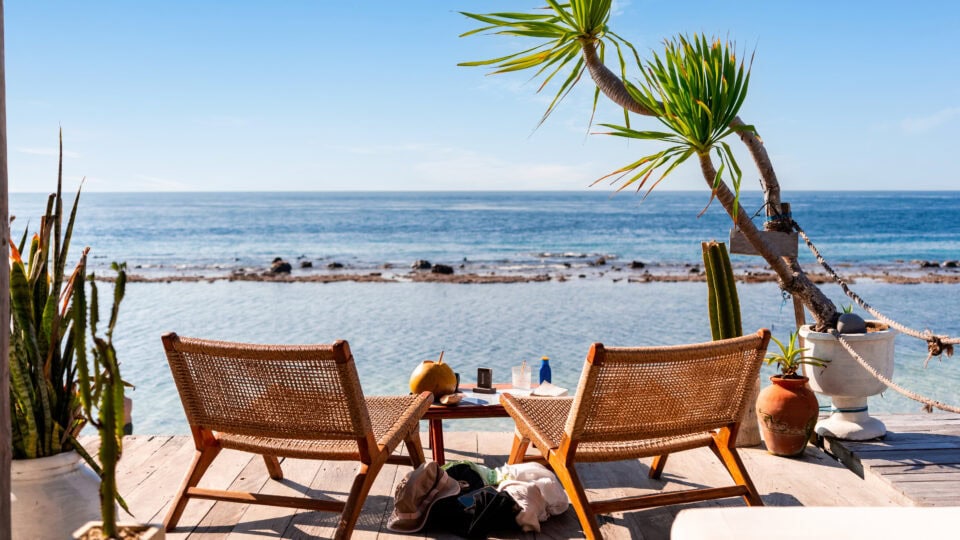 Two chairs by serene ocean view