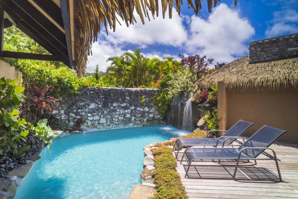 Tropical pool with lounge chairs