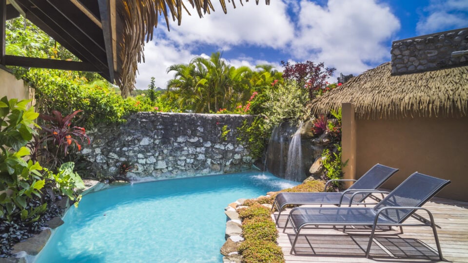 Tropical pool with lounge chairs