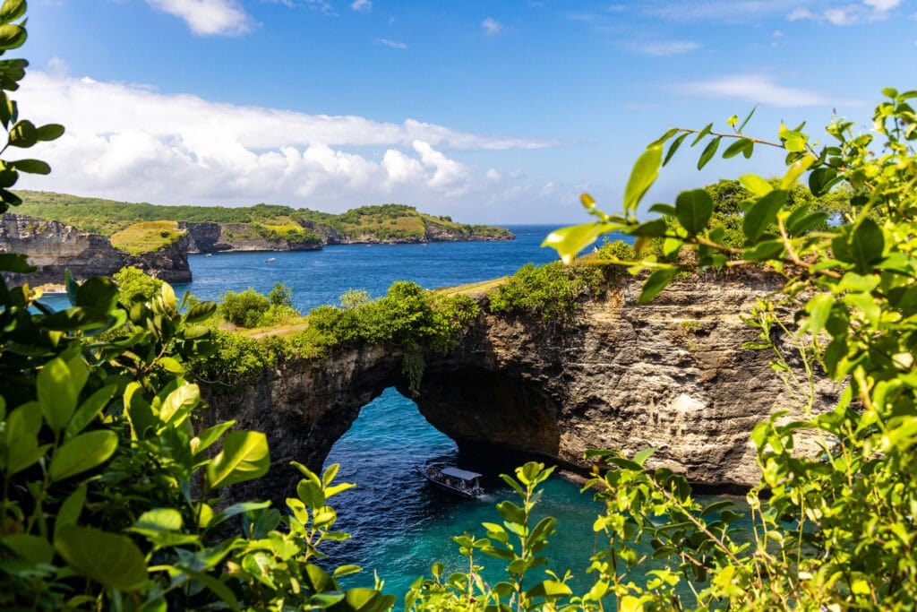 Scenic coastal view with archway.
