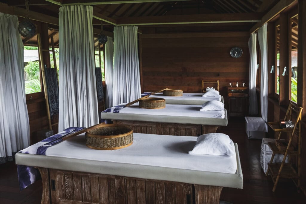 Serene spa room with massage tables.