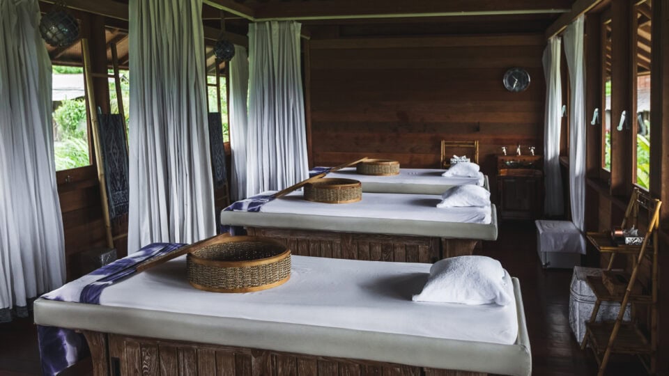 Serene spa room with massage tables.