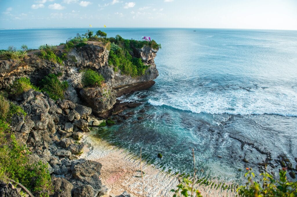 Cliffside view of serene beach.
