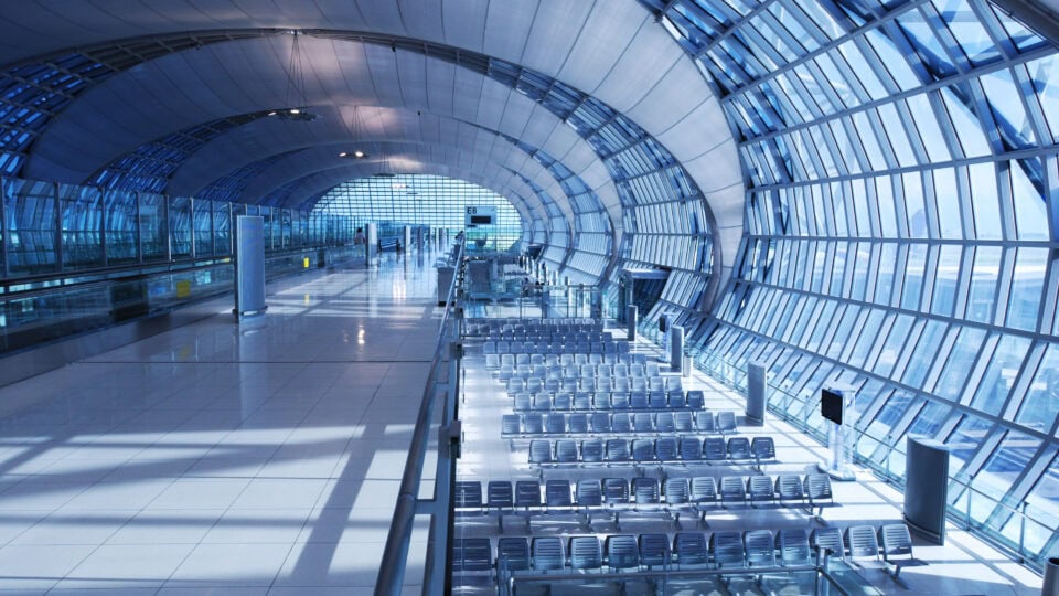 Modern airport lounge with large windows