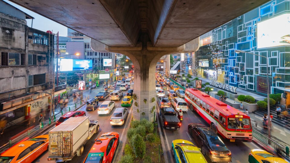 Busy urban street with colorful traffic