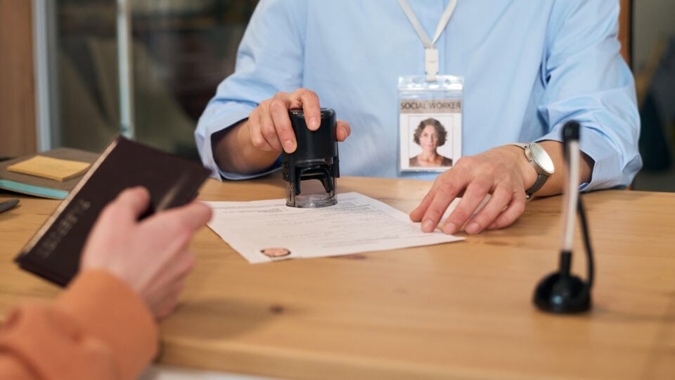 Stamping a document at a desk