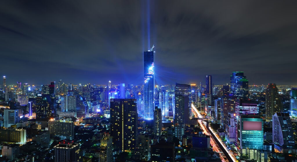 Illuminated skyline of Bangkok at night.
