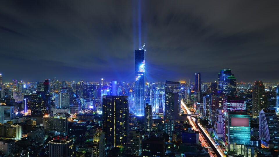 Illuminated skyline of Bangkok at night.