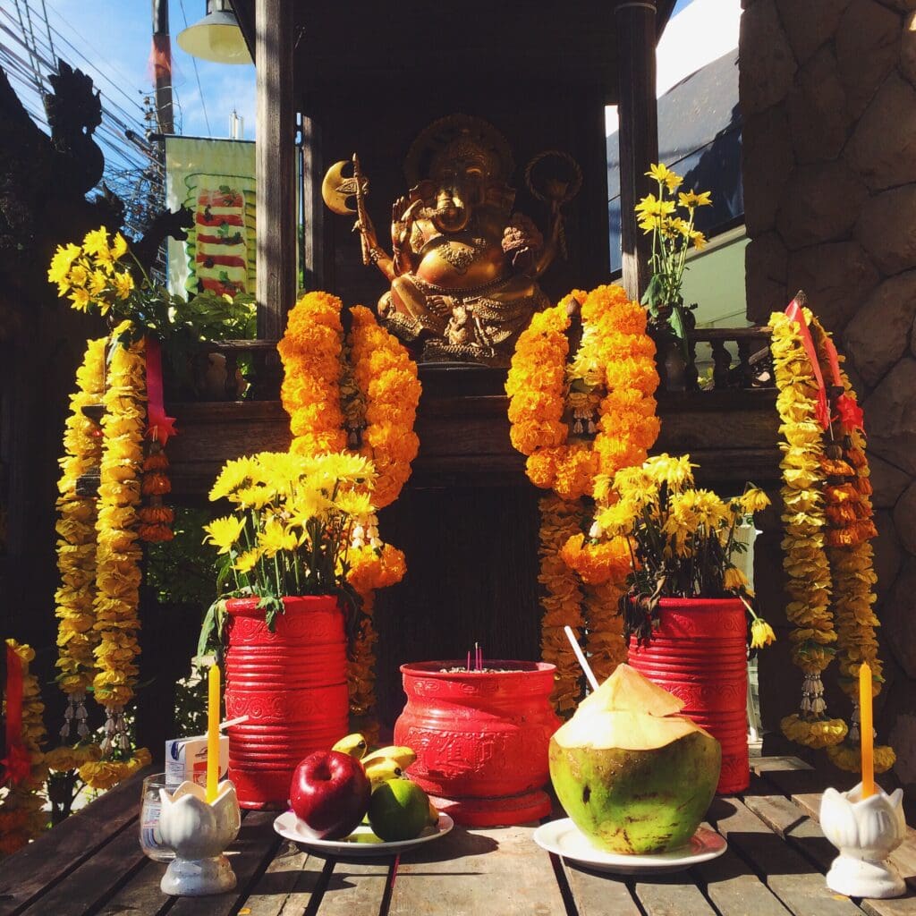 Colorful altar with offerings and flowers