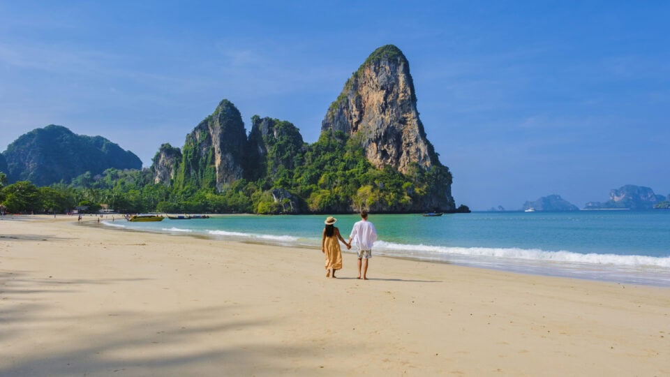 Couple walking on a beautiful beach.