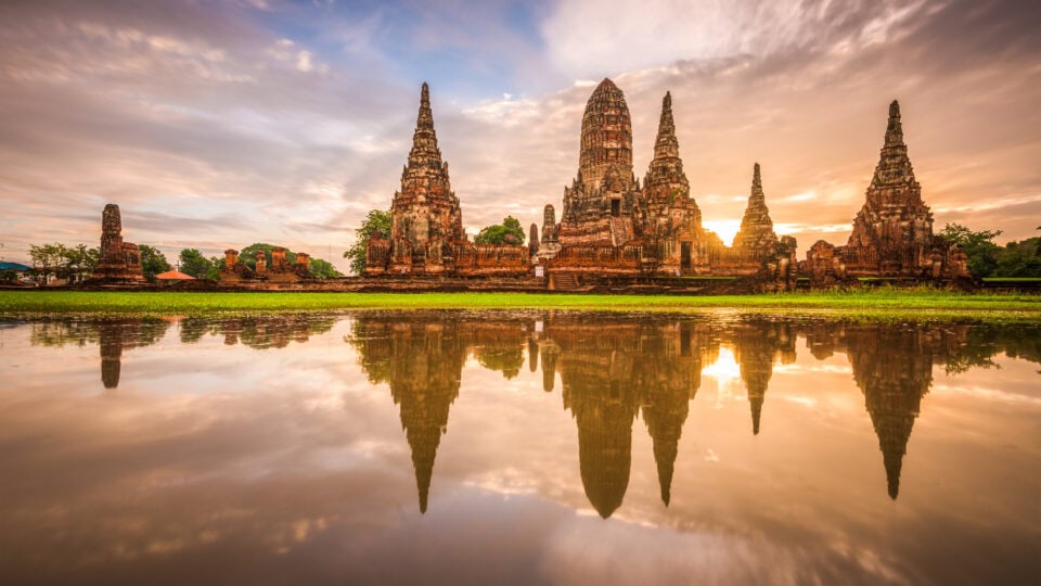 Historic temple reflecting in water.