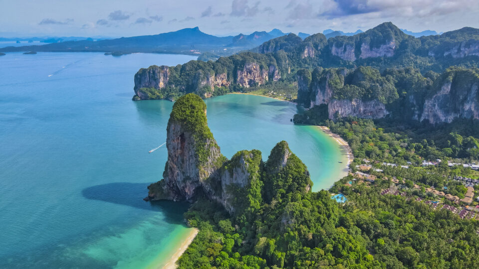 Stunning tropical beach with limestone cliffs.