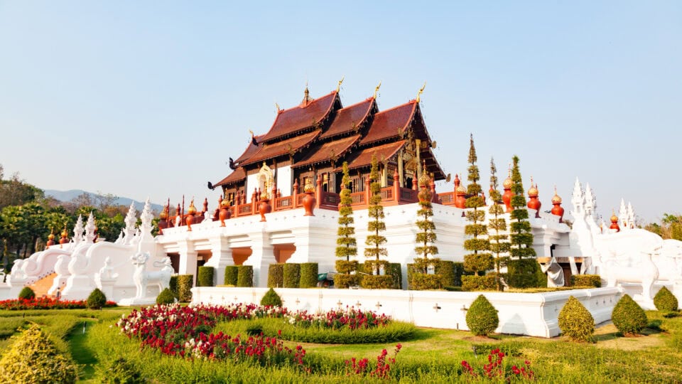 Traditional Thai architecture surrounded by gardens.