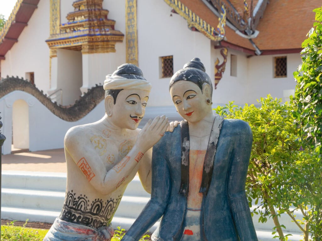 Statues of couple in traditional attire