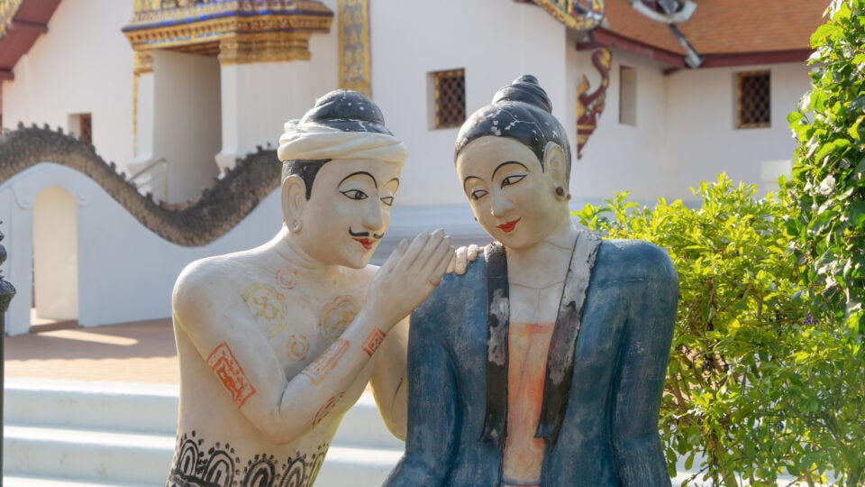 Statues of couple in traditional attire