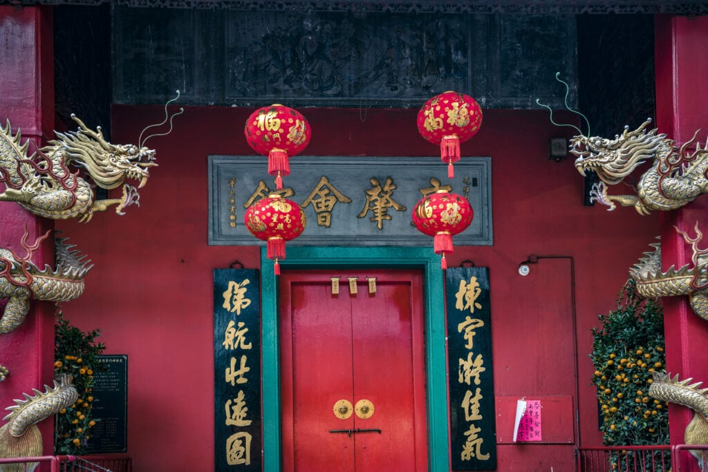 Red lanterns adorn a temple entrance.