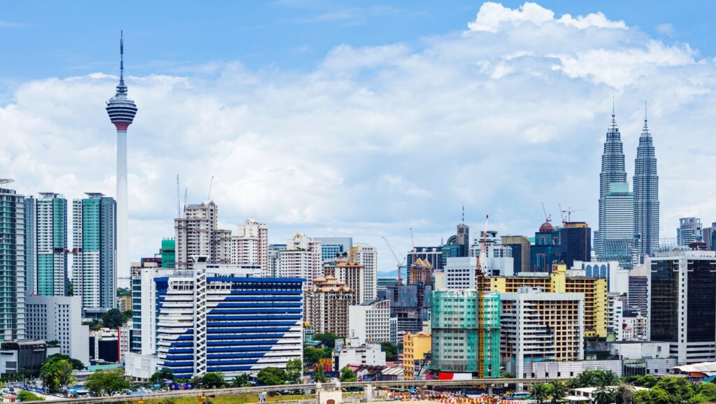 Modern skyline with iconic towers.