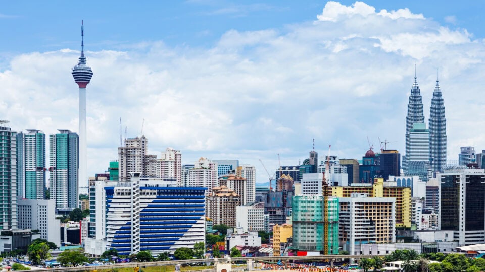 Modern skyline with iconic towers.