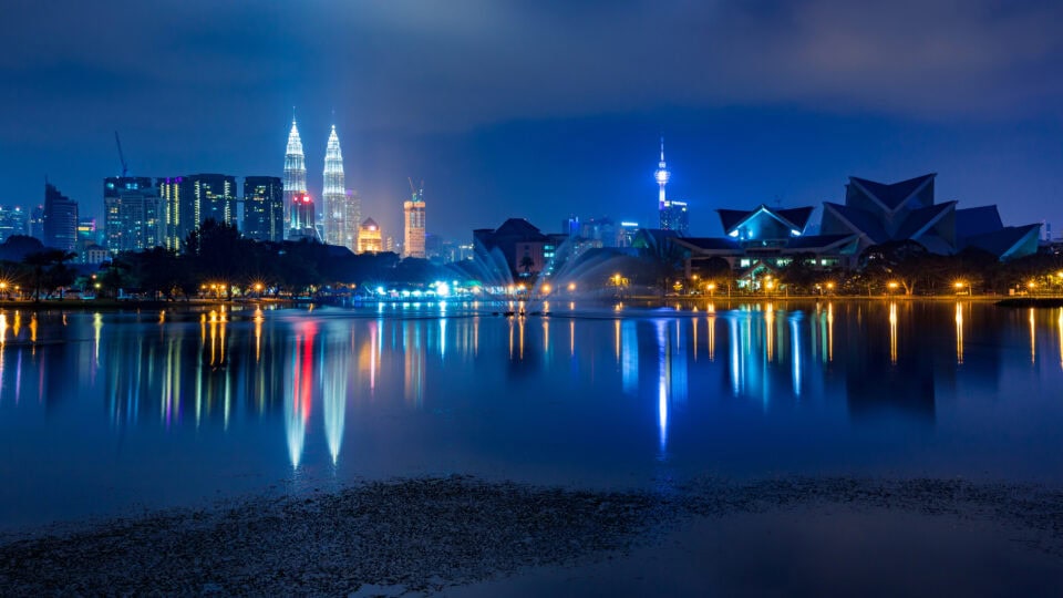 City skyline illuminated at night.