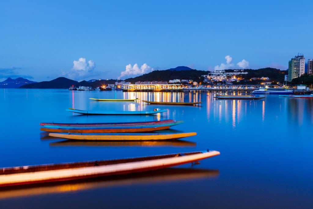 Boats on calm water at twilight.
