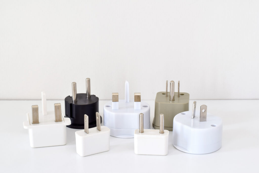Various international power adapters displayed together.