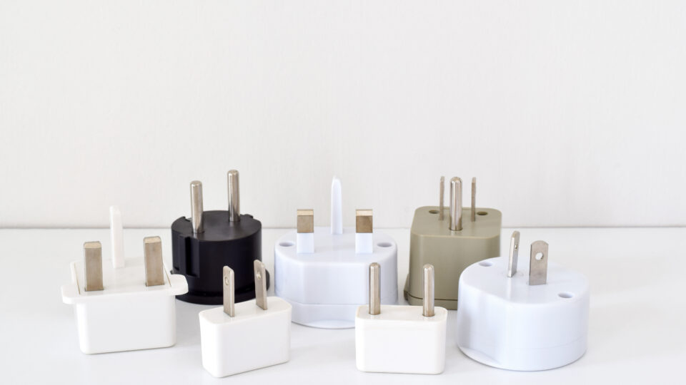 Various international power adapters displayed together.
